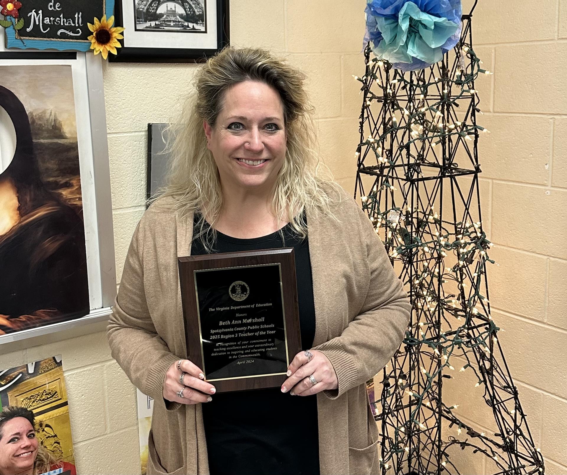 Beth Marshall holding a Virginia Regional Teacher of the Year plaque